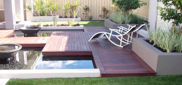 A hardwood deck - a pool - seats - and the complimentary planters make up this alfresco area in Perth.