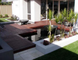 hardwood Decking Surround to Pond, with planters and plants. Perth Australia